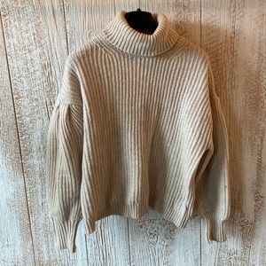 Cream drop sleeve turtleneck sweater